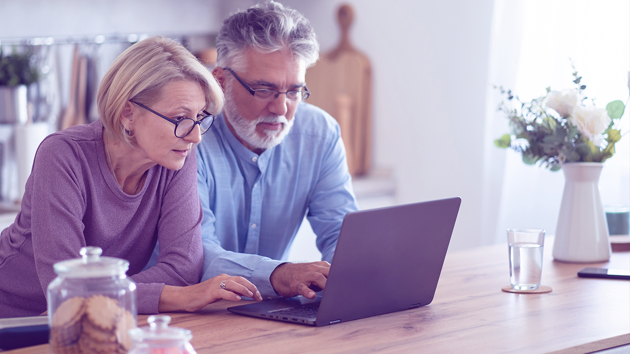 Older couple looking at laptop